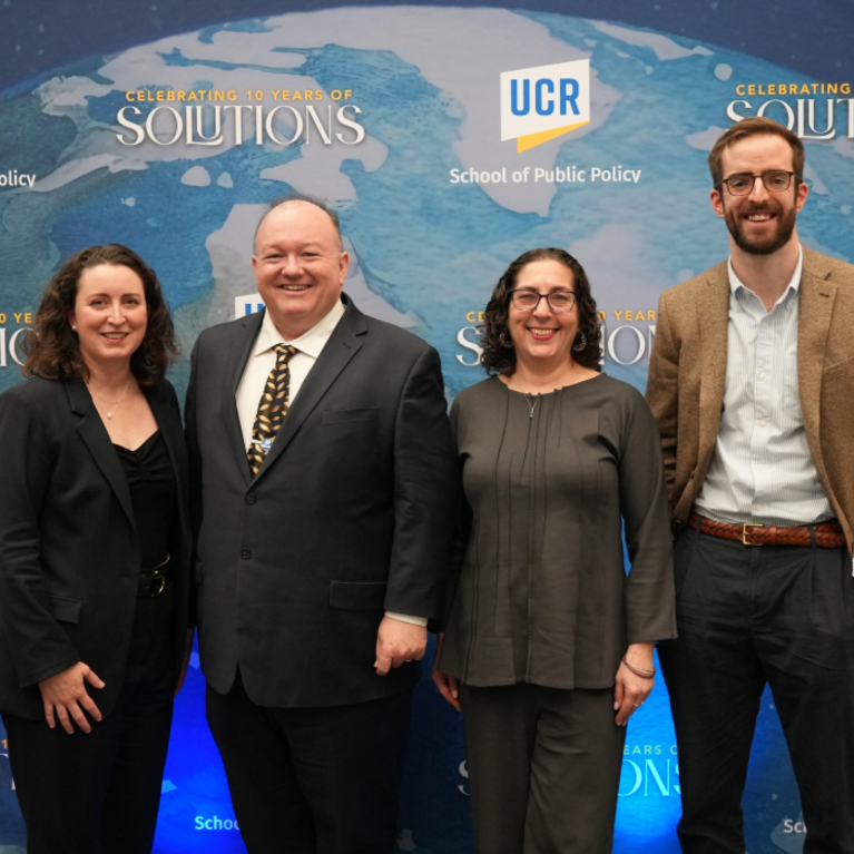 A group photo of Panelist Liza Reed, Dean Mark Long, Panelist Sara Mogulescu, and Panelist Alec Stapp